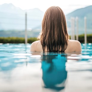 A woman in the outdoor pool