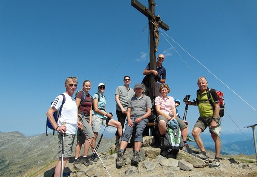 A group of hikers on a mountain peak