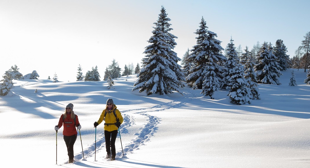 Two women on a snowshoe hike