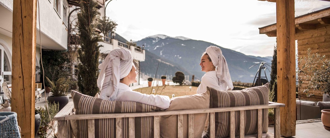 Two women are enjoying the view from a relaxation area