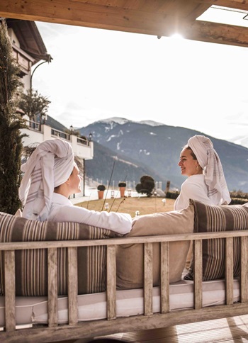 Two women are enjoying the view from a relaxation area